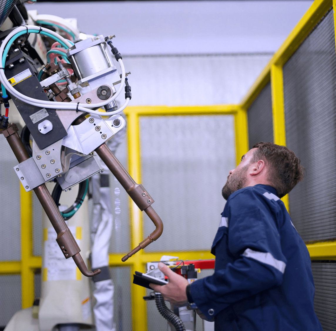 Engineer operating industrial machinery