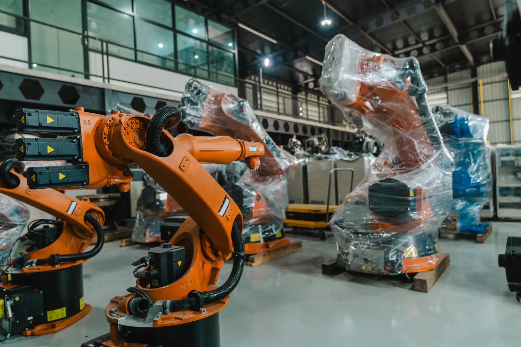 Robotic arms in a factory setting